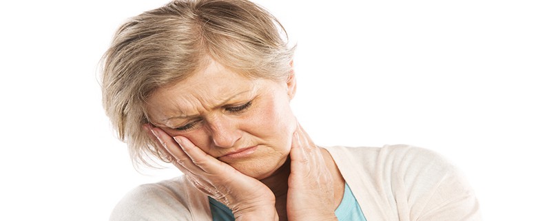 woman suffering from TMJ pain