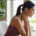woman holding her scalene muscles in her neck